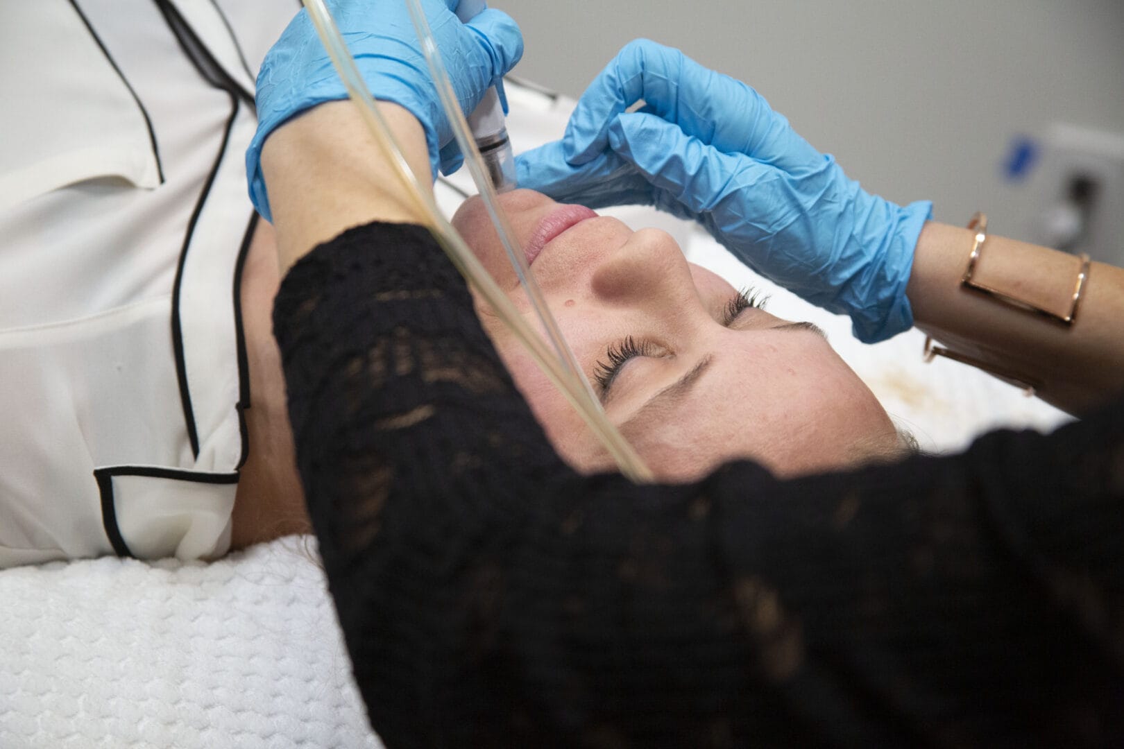 a woman getting a diamondglow facial at Fargo Wellness District